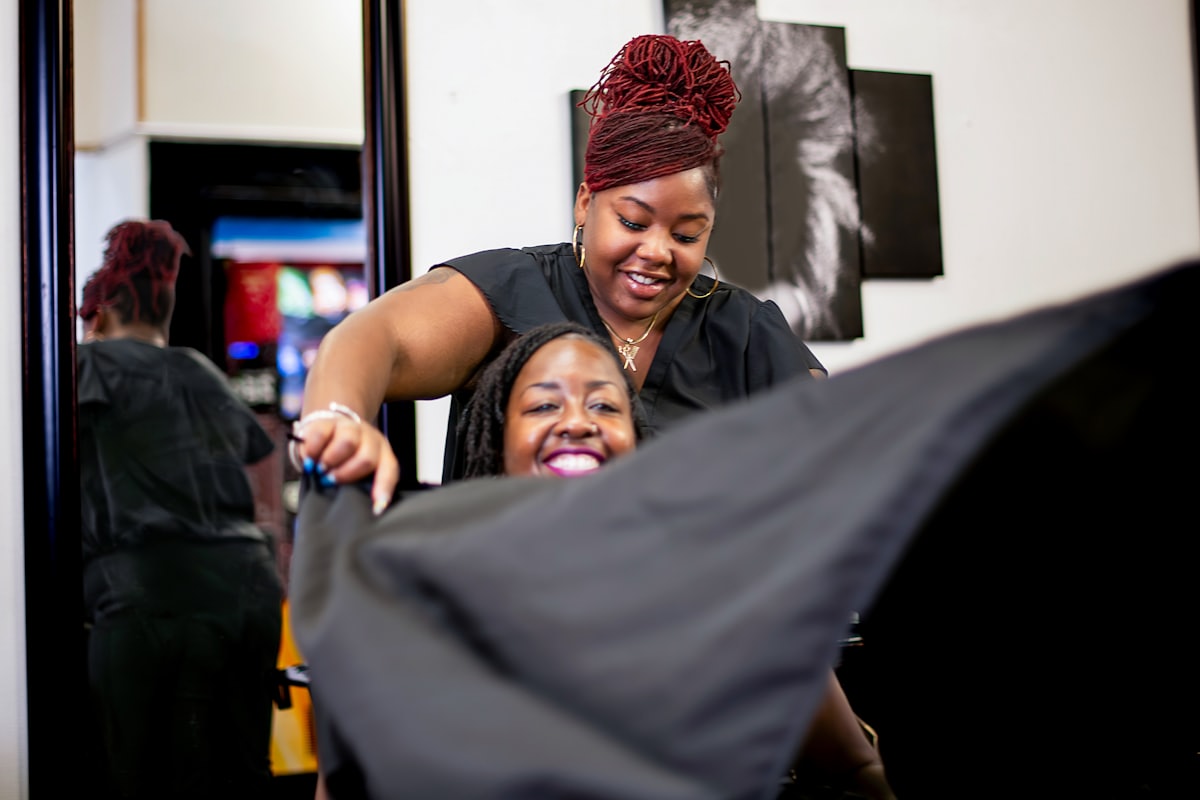 Barber shaving a client at the barbershop
